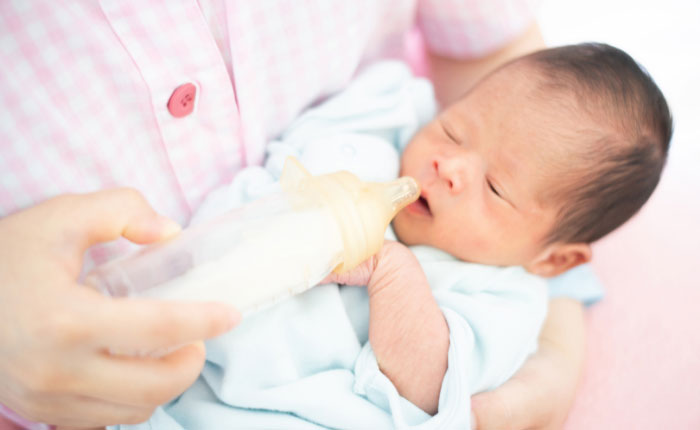 baby spit up breast milk but not formula